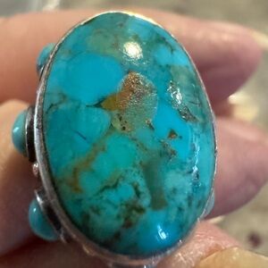 Native American vintage  sterling Silver Ring with turquoise beads all around.